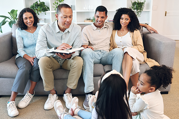 Senior family, children and reading book for learning, teaching